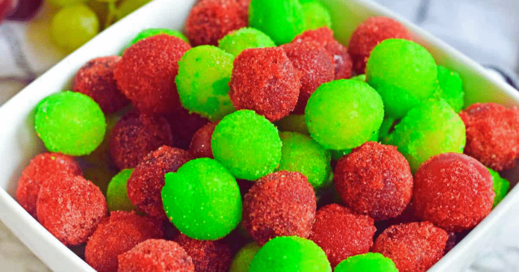 A bowl filled with a mix of red and green grapes, showcasing their vibrant colors and fresh appearance.